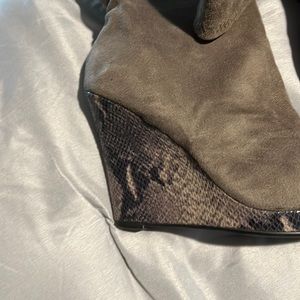 Tan wedge boots with faux snakes in wedge. Barely worn!